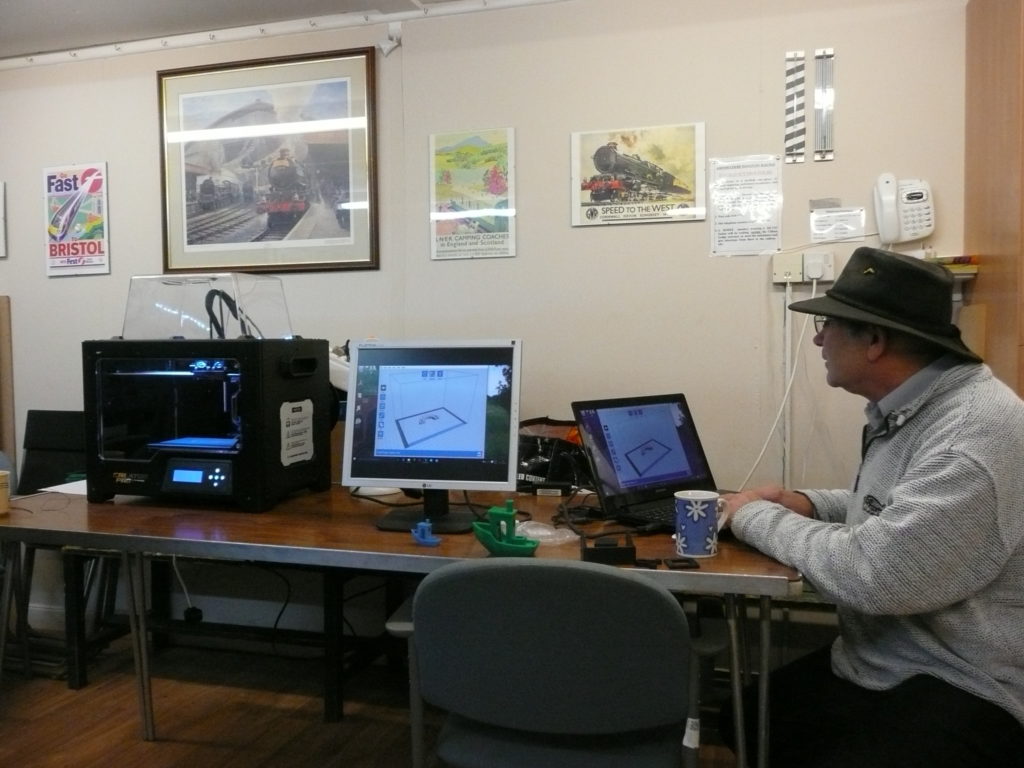 Quenton demonstrating the processing of the 3D design ready for printing.